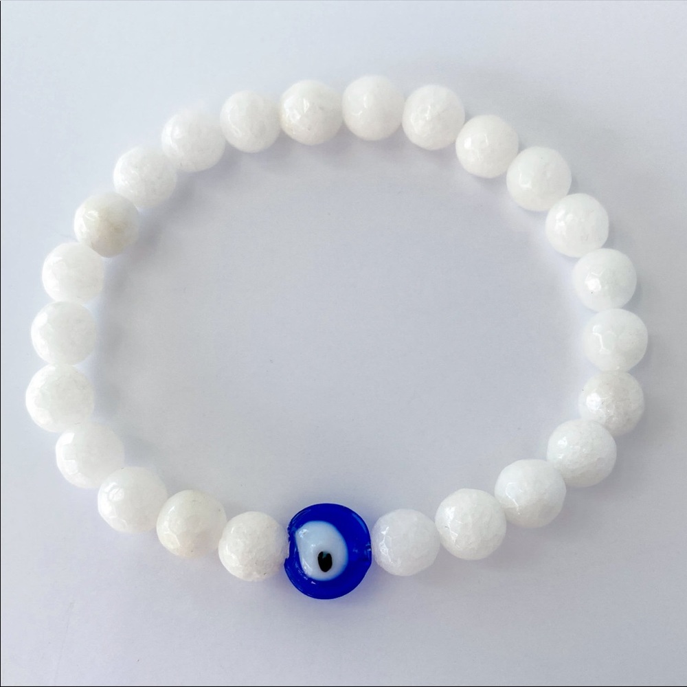 Genuine quartz and lampwork evil eye bracelet.  One size
